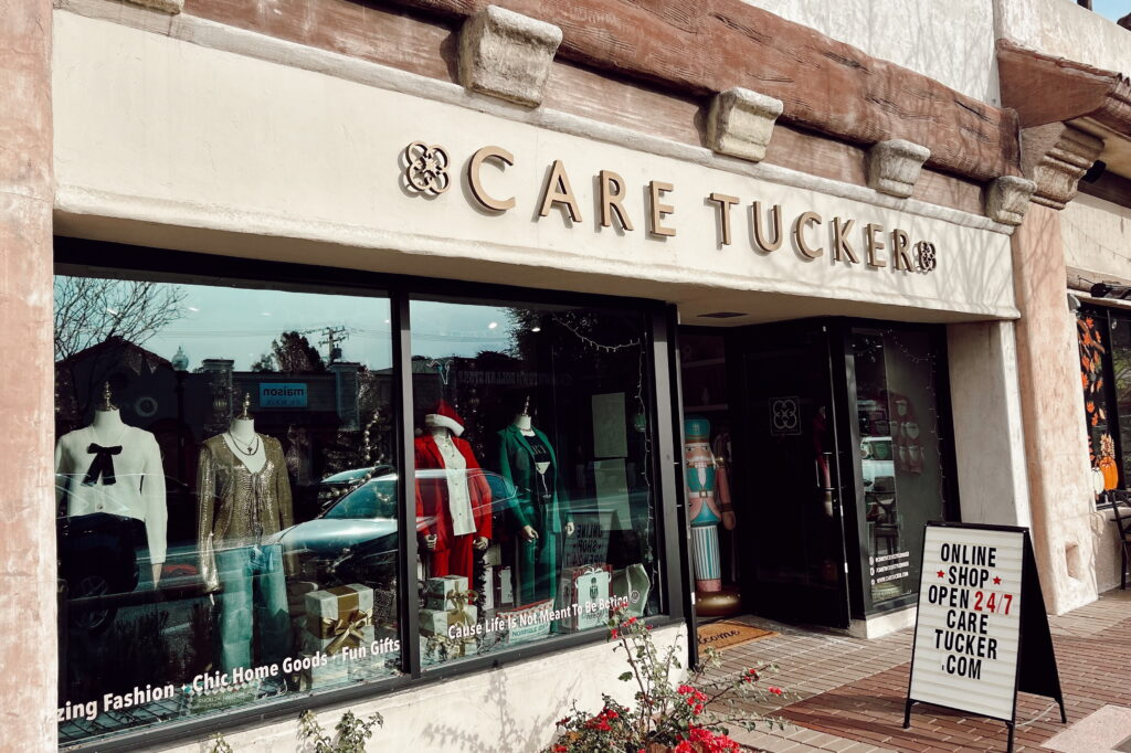 The Care Tucker boutique storefront with holiday window displays
