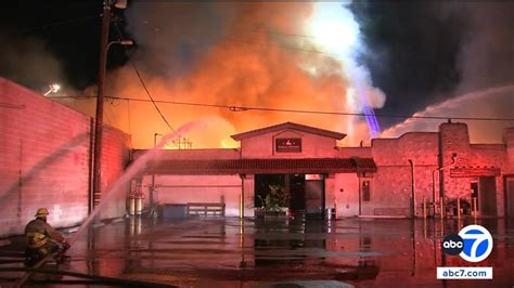 Fire crews battling heavy flames and smoke at the Newhall Refinery building